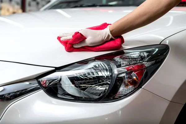 depositphotos_103206614-Car-detailing-series-Worker-waxing-white-car